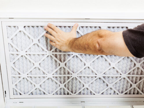 Man replacing a HEPA filter